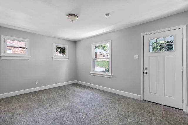 view of carpeted entrance foyer