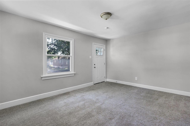 spare room featuring carpet floors