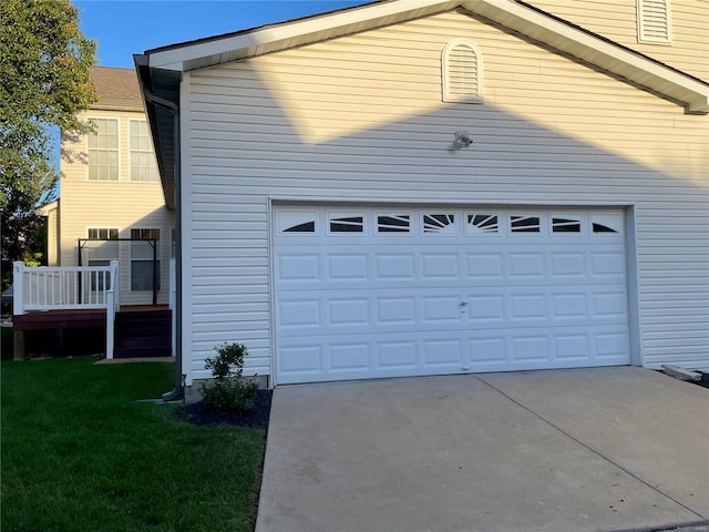 garage featuring a lawn