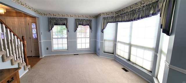 interior space with a healthy amount of sunlight and an inviting chandelier