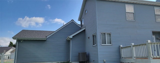 view of side of home with a deck