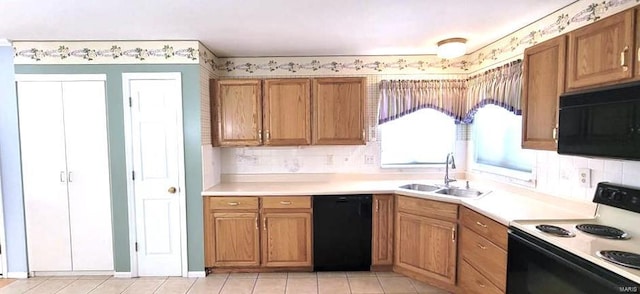 kitchen with tasteful backsplash, sink, and black appliances