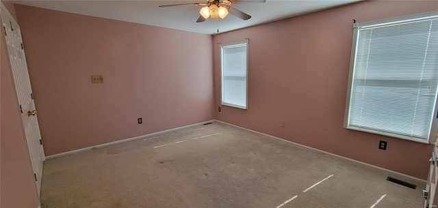 carpeted empty room with ceiling fan