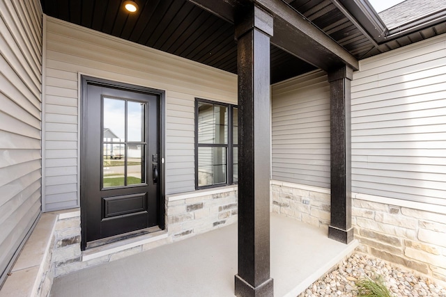 property entrance featuring covered porch