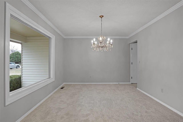 spare room with light carpet, a textured ceiling, crown molding, and a notable chandelier