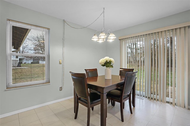 dining space with a chandelier