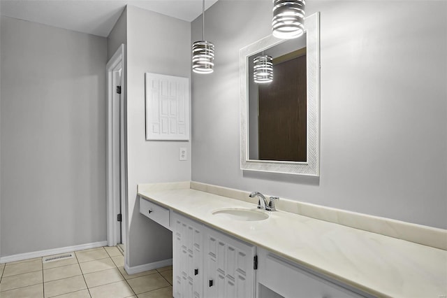 bathroom with tile patterned flooring and vanity