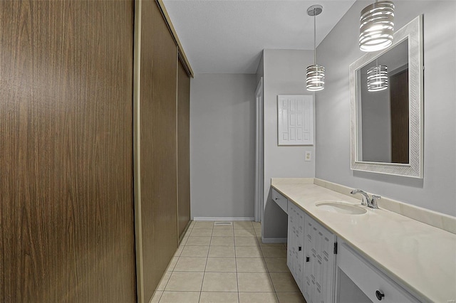 bathroom with tile patterned floors and vanity