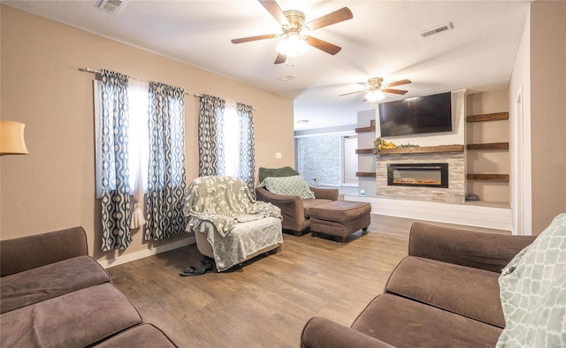 living room with ceiling fan and light wood-type flooring