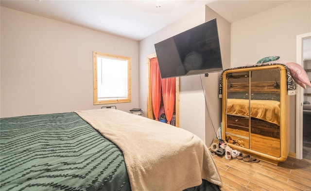 bedroom featuring wood-type flooring