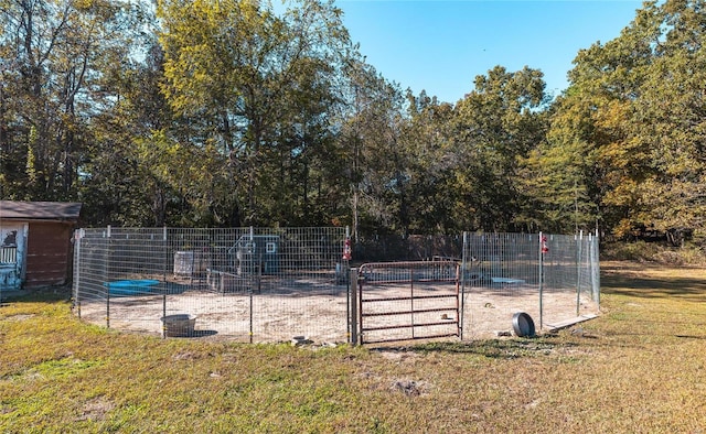 view of swimming pool with a yard