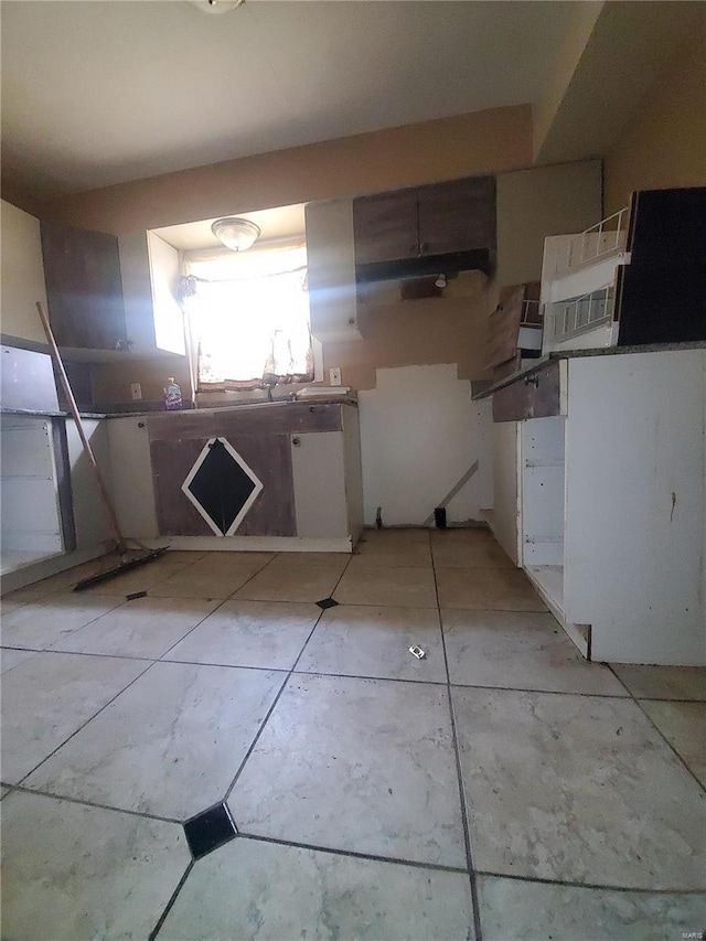 kitchen featuring white cabinets