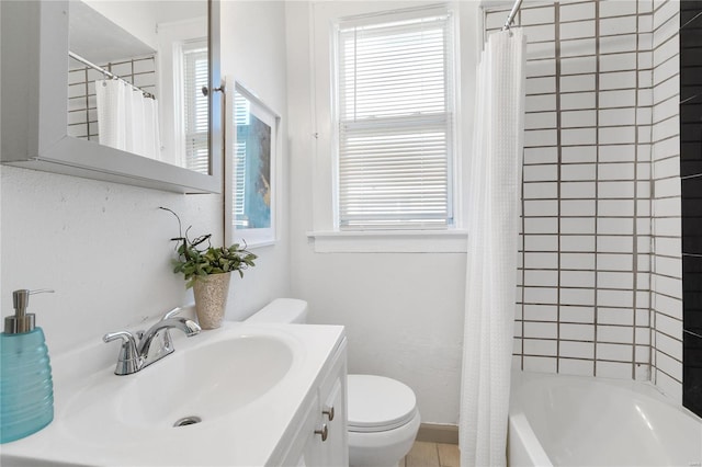 full bathroom with vanity, plenty of natural light, toilet, and shower / tub combo