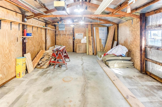 basement featuring wooden walls