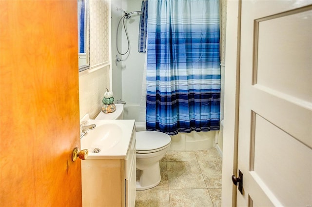 full bathroom featuring tile patterned floors, vanity, toilet, and shower / bathtub combination with curtain