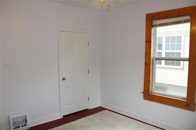 unfurnished room with ceiling fan