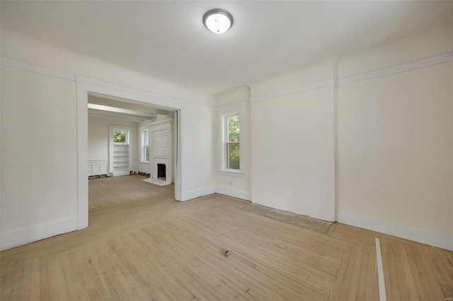 spare room with light hardwood / wood-style flooring