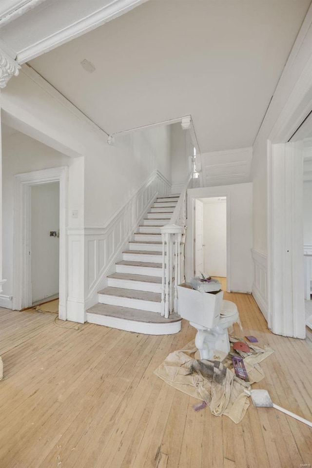 stairway featuring hardwood / wood-style floors