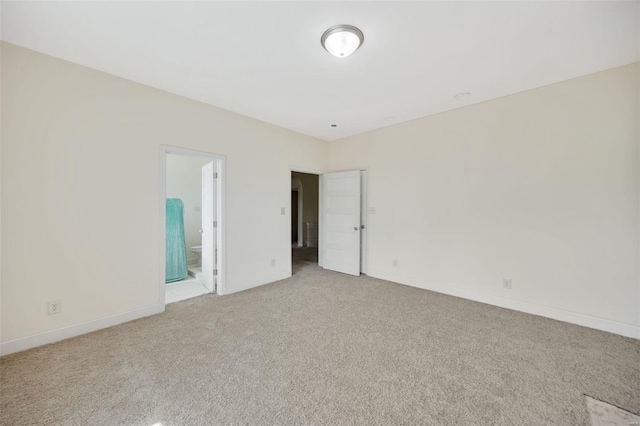 empty room featuring light colored carpet