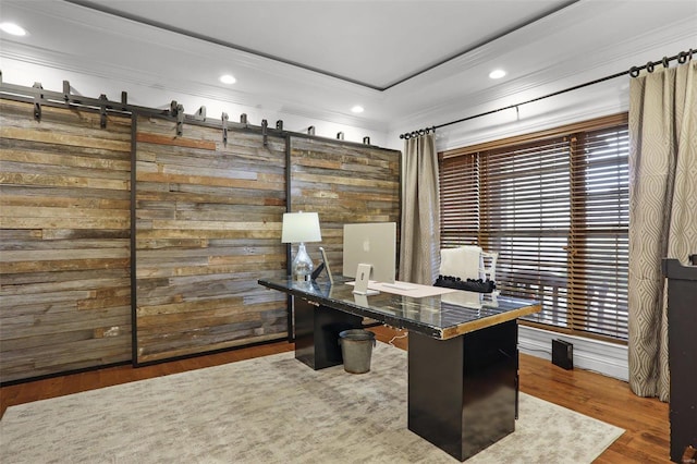 office area with hardwood / wood-style flooring and crown molding