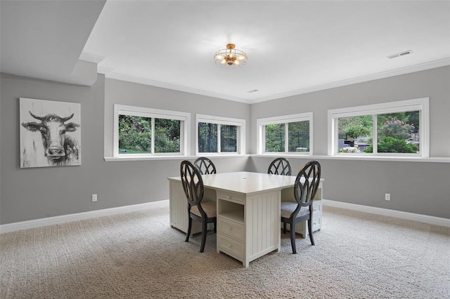 carpeted dining area featuring ornamental molding