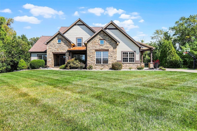 craftsman inspired home with a front lawn