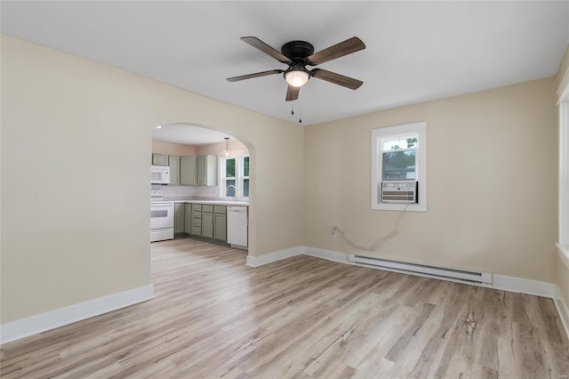 unfurnished living room with light hardwood / wood-style floors, cooling unit, baseboard heating, and ceiling fan