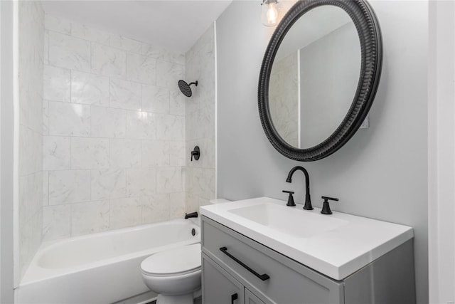 full bathroom with vanity, toilet, and tiled shower / bath