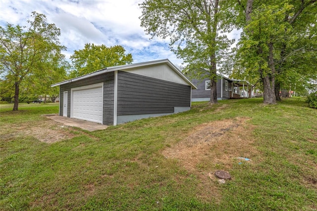 garage featuring a lawn