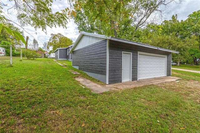 garage with a yard