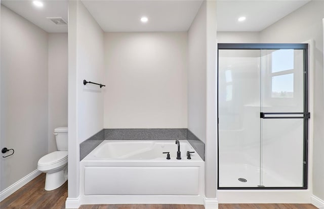 bathroom with visible vents, a garden tub, toilet, and a shower stall