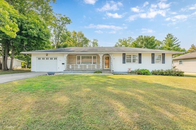 ranch-style house featuring a garage, covered porch, and a front yard