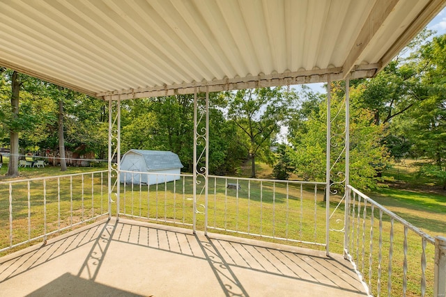 view of patio featuring a shed