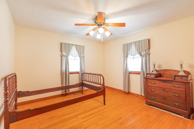 bedroom featuring ceiling fan and light hardwood / wood-style flooring