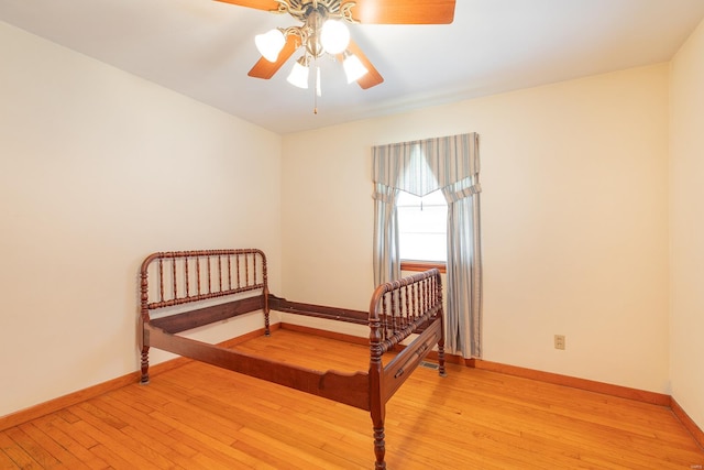 bedroom with light wood-type flooring and ceiling fan