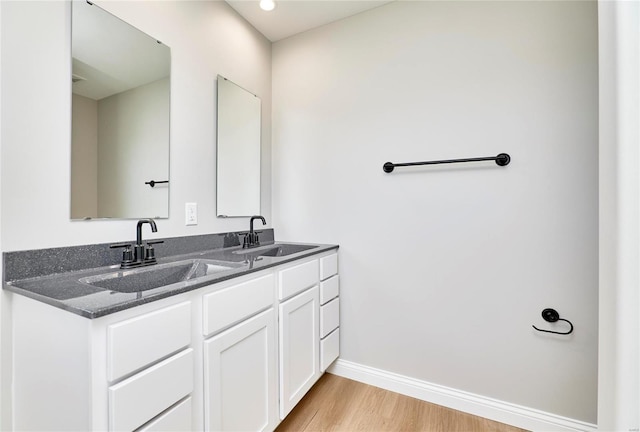 bathroom featuring hardwood / wood-style floors and vanity