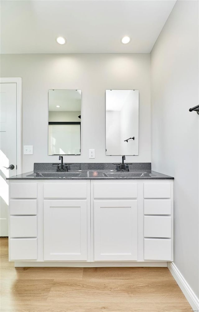 bathroom featuring vanity and wood-type flooring