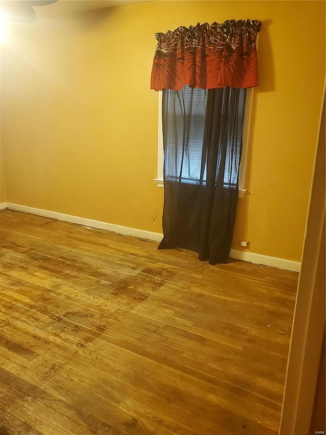 empty room featuring wood-type flooring