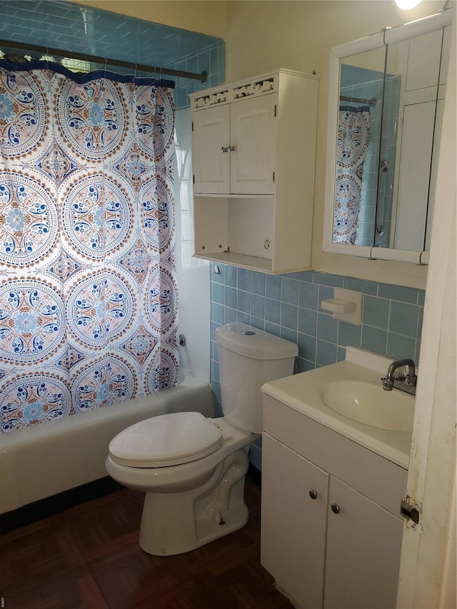 full bath featuring decorative backsplash, tile walls, vanity, toilet, and shower / bath combo with shower curtain