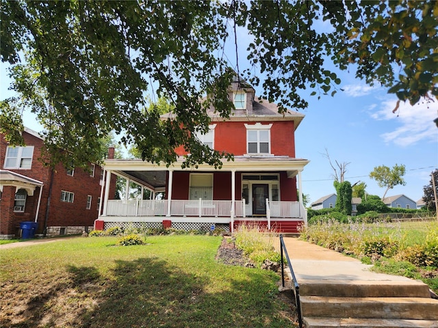 view of front facade with a porch and a front yard