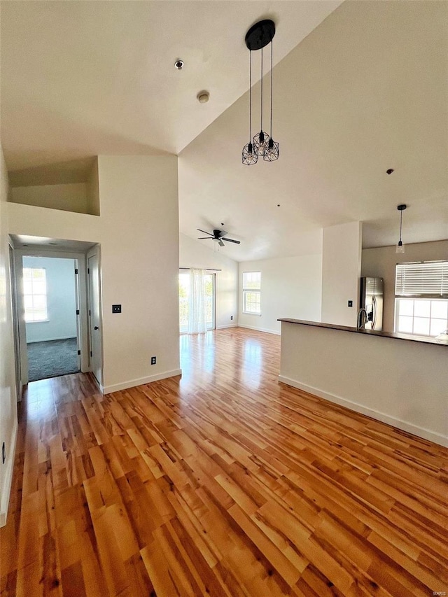 unfurnished living room with plenty of natural light and light hardwood / wood-style floors