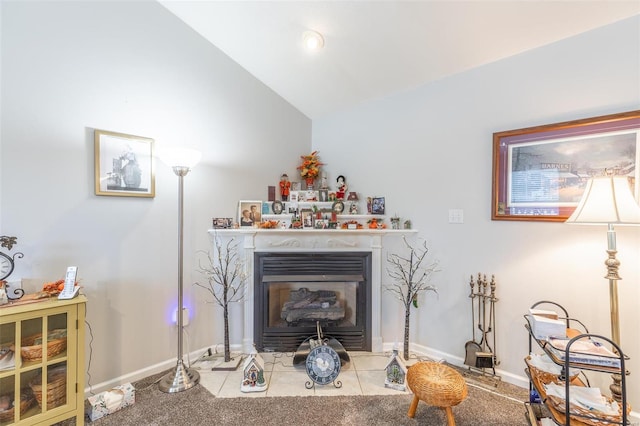 living room featuring carpet and lofted ceiling