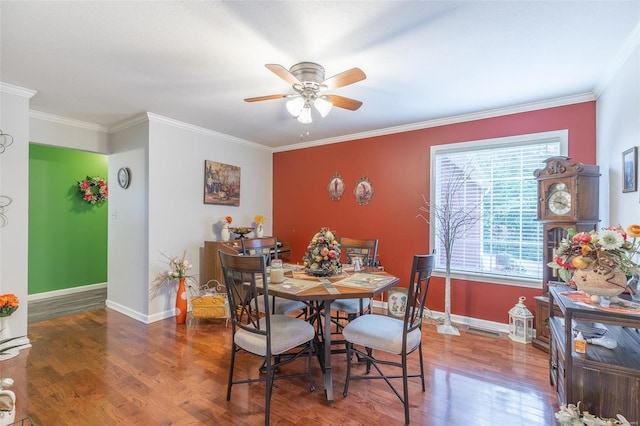 dining space with ceiling fan, hardwood / wood-style floors, and crown molding