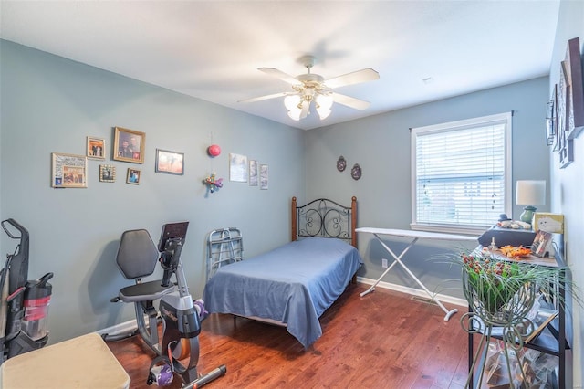 bedroom featuring ceiling fan and dark wood-type flooring