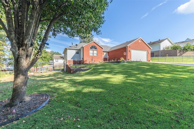 exterior space with a garage and a front lawn