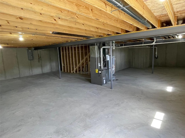 basement with electric panel and heating unit