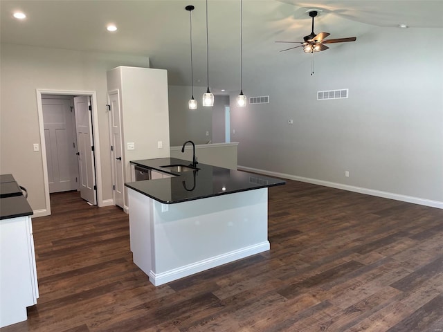 kitchen with sink, decorative light fixtures, dark hardwood / wood-style flooring, a kitchen island with sink, and white cabinets