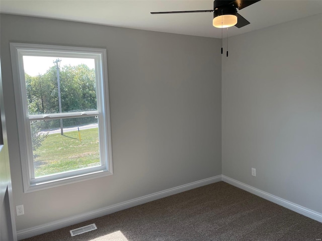 carpeted empty room with ceiling fan