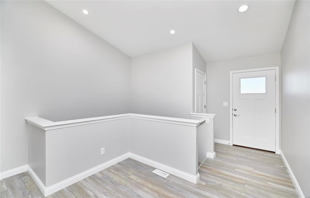 entryway with light hardwood / wood-style floors