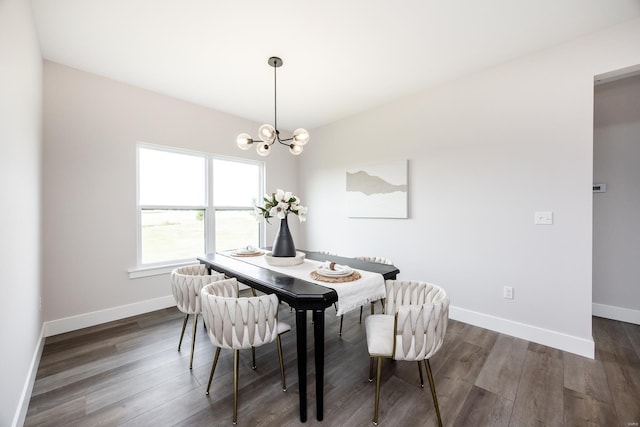 dining space with an inviting chandelier and dark hardwood / wood-style floors